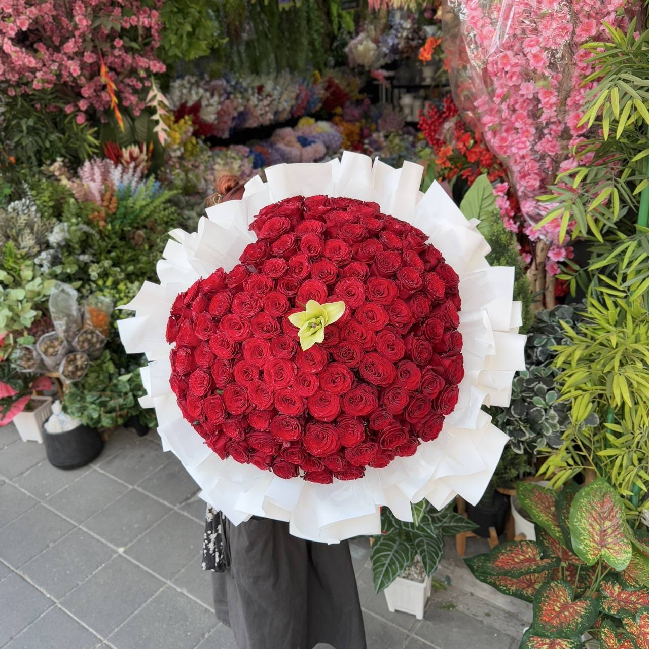 Heart of Love – 100 Red Roses Heart Bouquet with White Lily - BestBloomBuddy