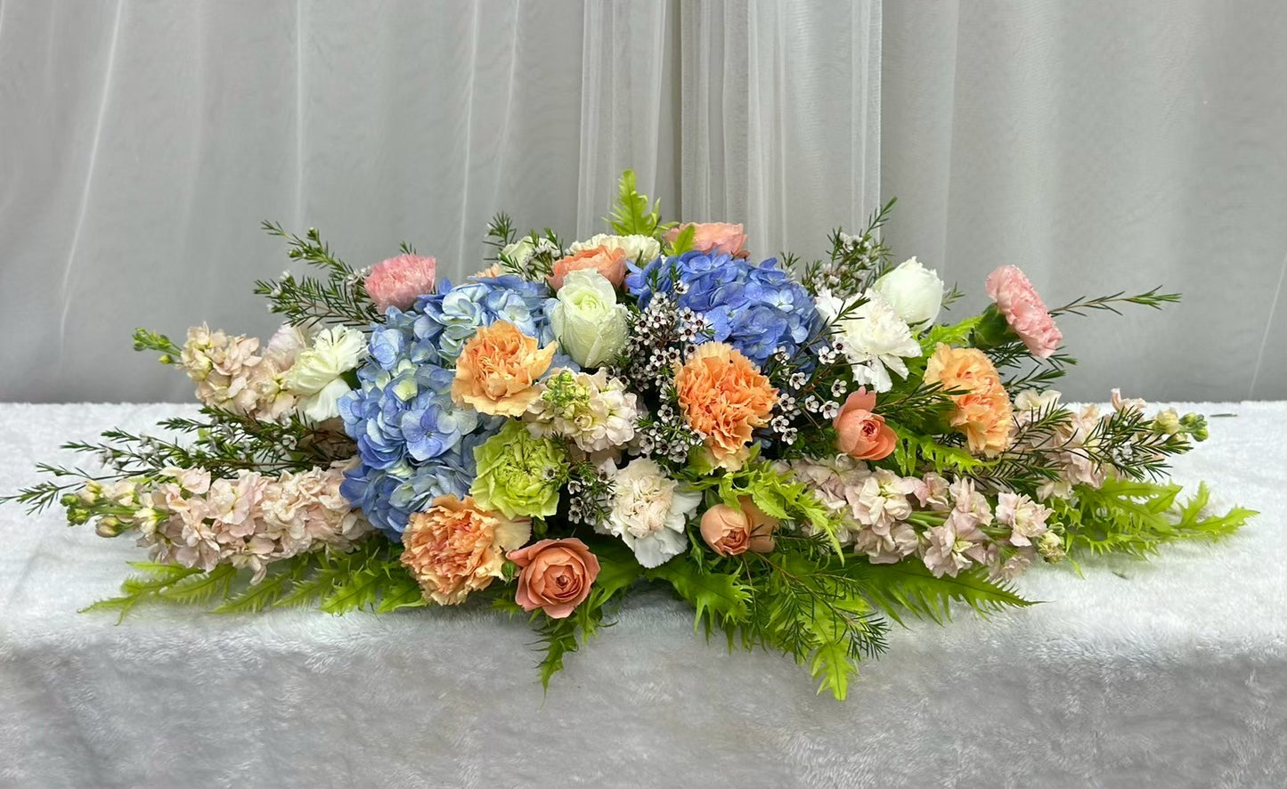 Festive Harmony – Flower Centerpiece (Peachy & Blue Flower)