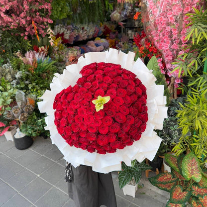 Heart of Love – 100 Red Roses Heart Bouquet with White Lily - BestBloomBuddy