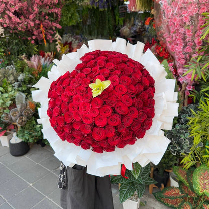Heart of Love – 100 Red Roses Heart Bouquet with White Lily - BestBloomBuddy