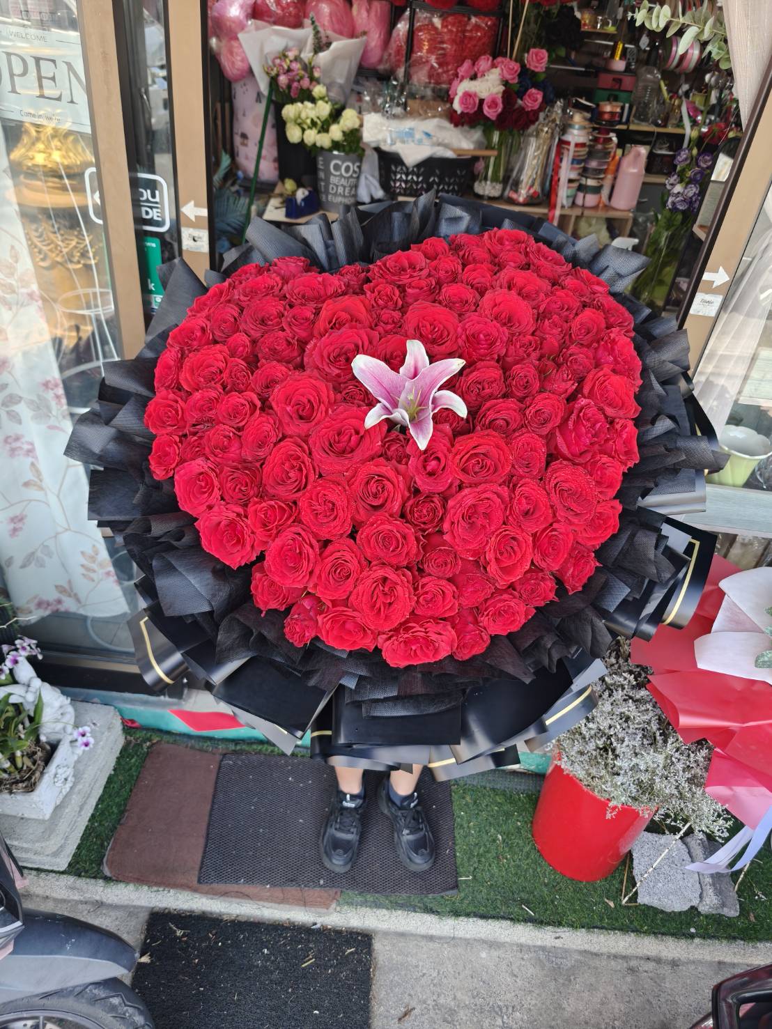 Heart of Passion – 100 Red Roses Heart Bouquet with Pink Lily - BestBloomBuddy