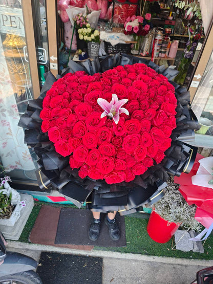 Heart of Passion – 100 Red Roses Heart Bouquet with Pink Lily - BestBloomBuddy