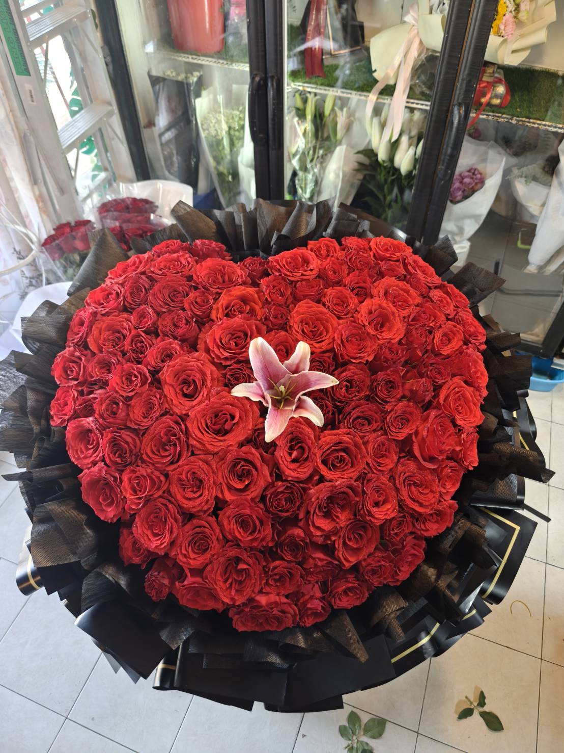 Heart of Passion – 100 Red Roses Heart Bouquet with Pink Lily - BestBloomBuddy