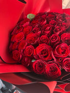 Lava Love 100 Red Roses bouquet by BestBloomBuddy, fresh red roses arranged in a beautiful floral display.