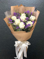 Cozy White – 7 White Roses with Purple Statice Bouquet - BestBloomBuddy