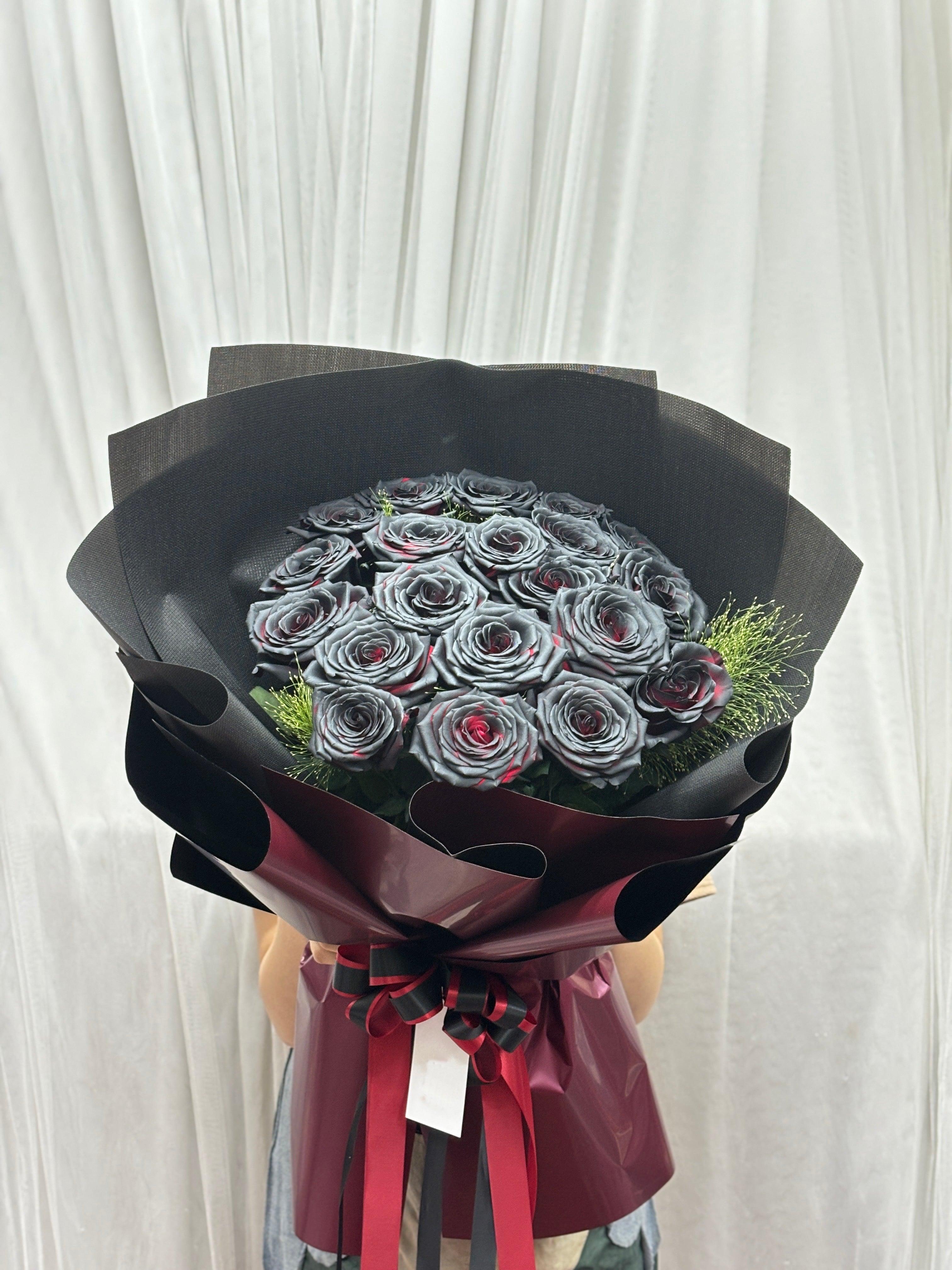 Black roses bouquet with 20 crimson eclipse roses arranged naturally, showcasing dark and vibrant floral display by BestBloomBuddy.