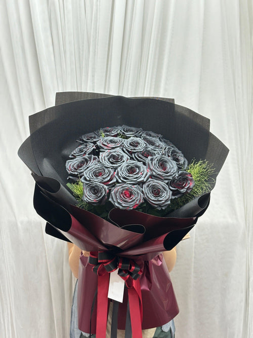 Black roses bouquet with 20 crimson eclipse roses arranged naturally, showcasing dark and vibrant floral display by BestBloomBuddy.