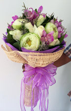 Purple Serenity – Lotus, Rose & Orchid Bouquet - BestBloomBuddy