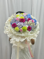 Mixed flower bouquet from BestBloomBuddy featuring colorful roses, daisies, and greenery in a vibrant arrangement.