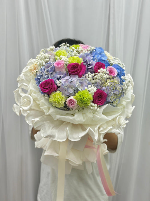 Mixed flower bouquet from BestBloomBuddy featuring colorful roses, daisies, and greenery in a vibrant arrangement.