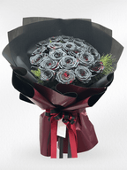 Black rose bouquet featuring 20 crimson eclipse roses by BestBloomBuddy, arranged in a lush, elegant floral display.