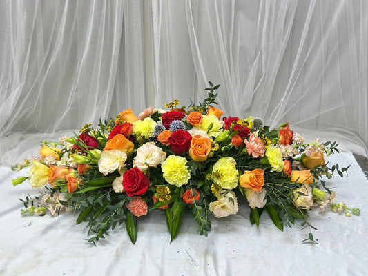 Radiant Gathering – Flower Centerpiece (Red, Yellow & Orange Flower)