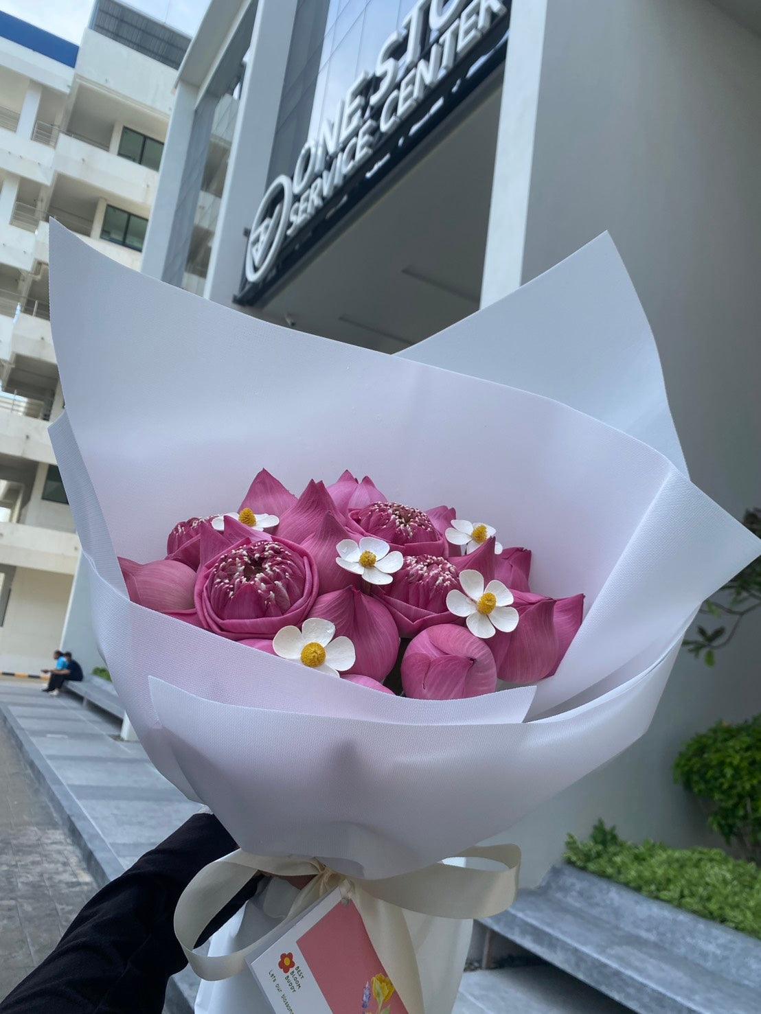 Pink lotus bouquet from Pure Grace by BestBloomBuddy, featuring vibrant pink lotus flowers arranged beautifully.