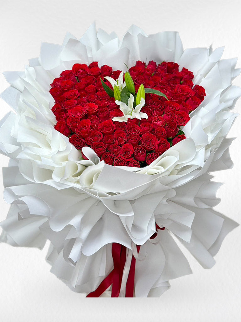 Heart of Love – 100 Red Roses Heart Bouquet with White Lily - BestBloomBuddy