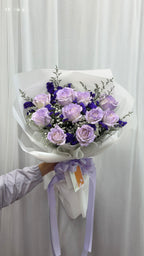 Lavender purple roses bouquet from BestBloomBuddy, featuring 10 fresh purple roses arranged beautifully.