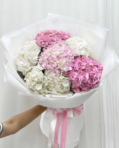 Pink hydrangea bouquet made of cotton flowers, curated by BestBloomBuddy, showcasing soft, fluffy pink blossoms perfect for home decor.